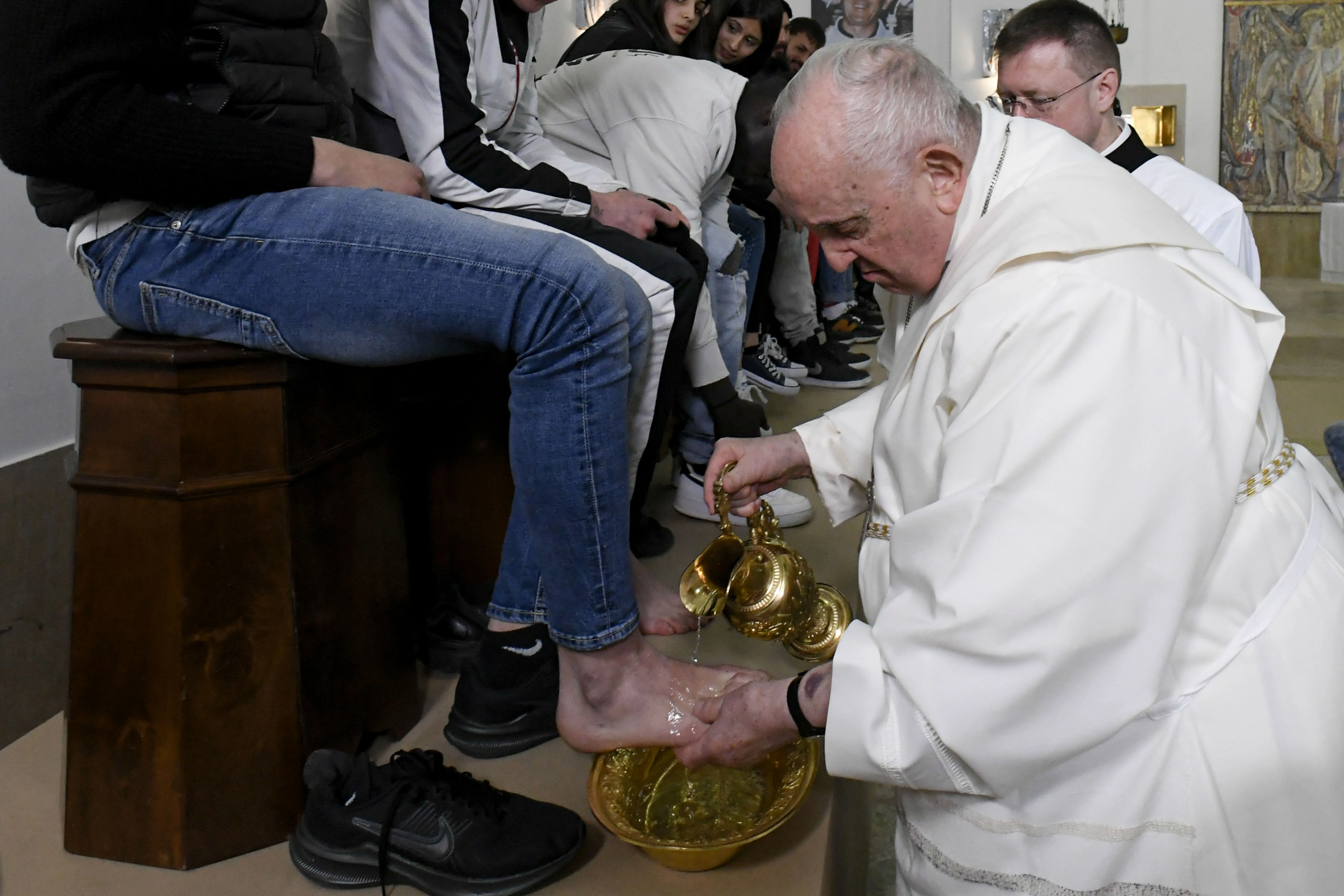 Pope Francis washes the feet of 12 young men and women, inmates at Casal del Marmo juvenile detention center on Rome’s outskirts, during a Mass of the Lord’s Supper on Thursday, April 6, 2023.?w=200&h=150