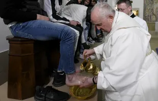 Pope Francis washes the feet of 12 young men and women, inmates at Casal del Marmo juvenile detention center on Rome’s outskirts, during a Mass of the Lord’s Supper on Thursday, April 6, 2023. Credit: Vatican Media
