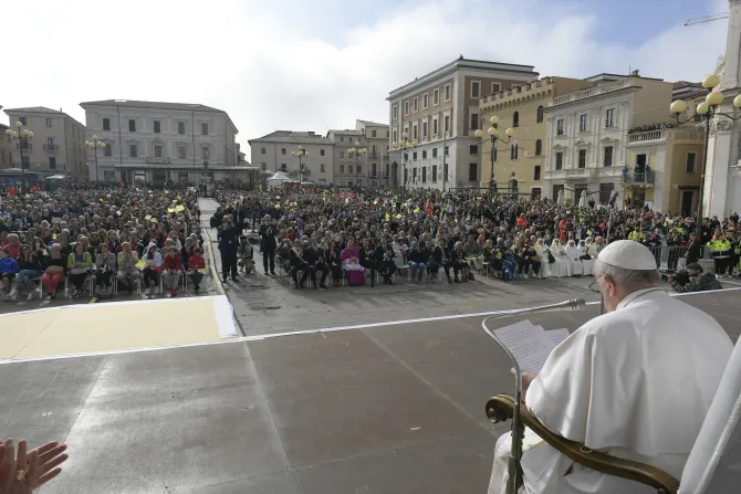 Pope Francis greets the families of earthquake victims in front of L'Aquila's damaged cathedral on Aug. 28, 2022.