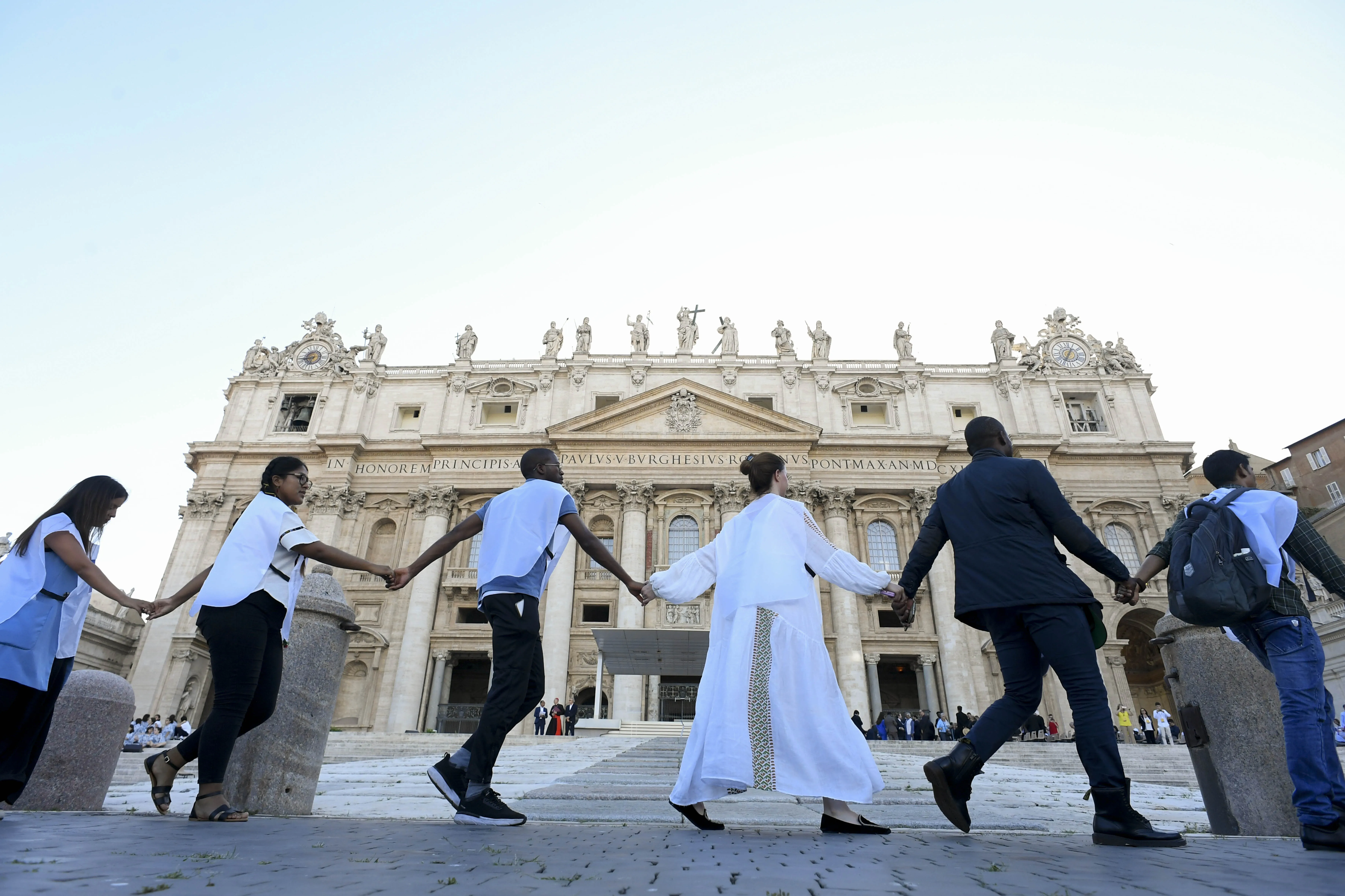 Young people from around the world held hands in St. Peter's Square during the #NotAlone human fraternity event June 10, 2023.?w=200&h=150