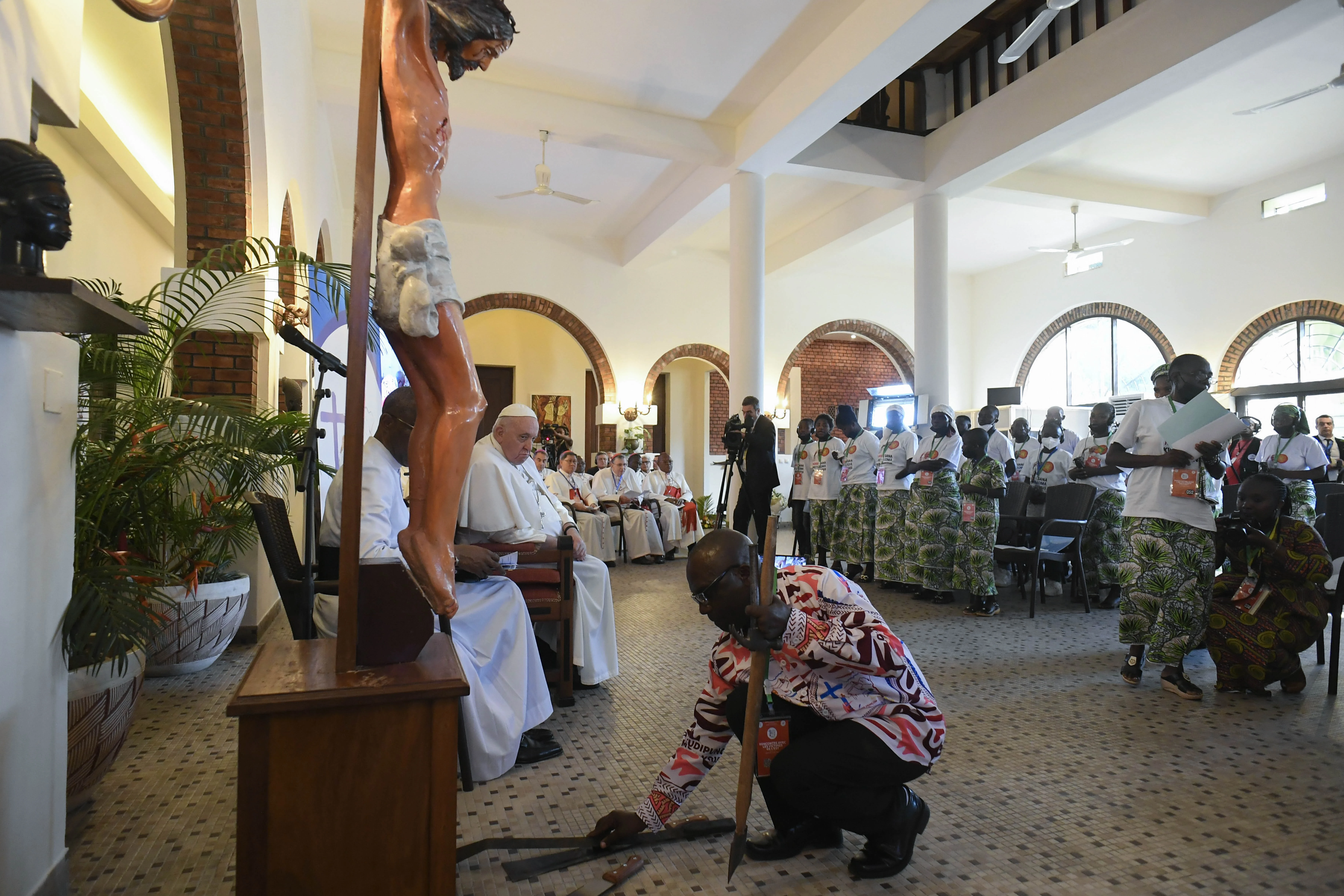 Young people from eastern Congo lay down the machetes and knives used to kill their families at the foot of Christ’s cross to symbolize their forgiveness in a moving encounter with Pope Francis during his trip to the country Feb. 1, 2023.?w=200&h=150
