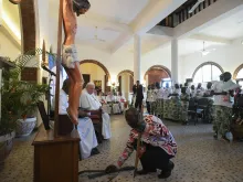 Young people from eastern Congo lay down the machetes and knives used to kill their families at the foot of Christ’s cross to symbolize their forgiveness in a moving encounter with Pope Francis during his trip to the country Feb. 1, 2023.