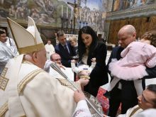 Pope Francis baptizes babies in the Sistine Chapel on Jan. 7, 2024.