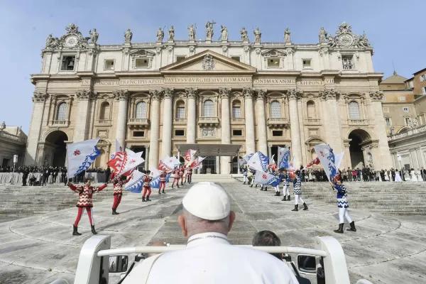 Pope Francis arrives at the general audience March 22, 2023, in the popemobile to a Florentine flag corps performance by a group that seeks to preserve Tuscany’s medieval and Renaissance traditions. Vatican Media