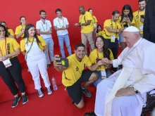 Pope Francis takes selfies with volunteers after closing Mass for WYD2023 in Lisbon, Aug 6, 2023.