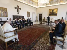 Pope Francis talks with lawyers from the Council of Europe at the Vatican on Monday, Aug. 21, 2023.