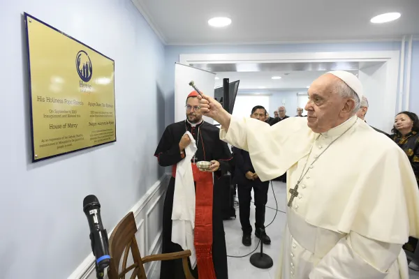 Pope Francis blesses the sign of a new charitable effort, the House of Mercy, in Ulaanbaatar, Mongolia, on Sept. 4, 2023. Vatican Media