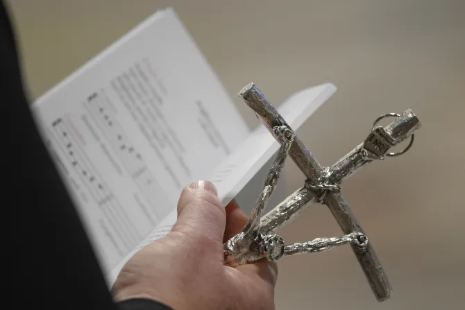 Pope Francis handed each catechist a silver crucifix.