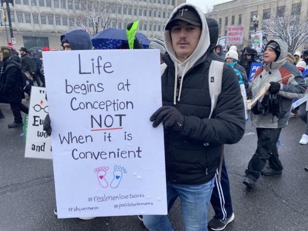 A marcher displays a sign at the 51st annual March for Life, Fri., Jan. 19, 2024. Joe Bukuras/CNA