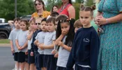 School children from St. Mary Academy watch the Eucharistic Procession on the campus of their home parish, St. Mary
of the Pines Church, Manahawkin, New Jersey, May 29, 2024.
