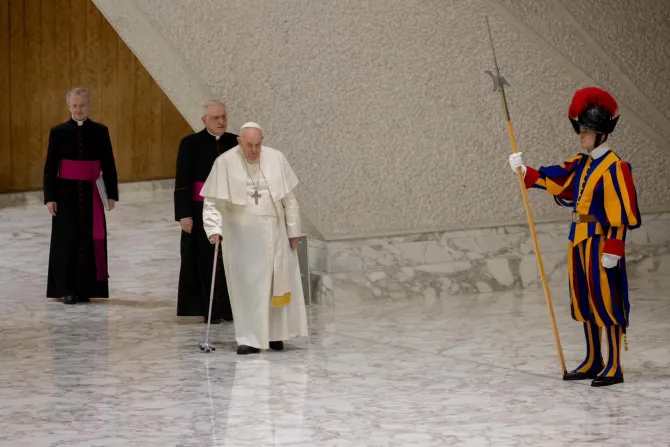 Pope Francis arrived at Paul VI Hall using a cane to walk on Jan. 18, 2023.