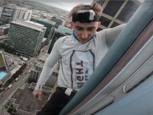 Maison DesChamps has assumed the brand of "pro-life spiderman" as he has scaled seven city skyscrapers to bring attention to the pro-life cause. In this photo, he is climbing the Accenture Tower in Chicago Oct. 10, 2023.