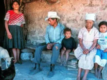 Honduran family in front of their adobe house near Tegucigalpa, Honduras.