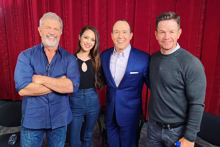 L-R: Actor Mel Gibson, writer and director Rosalind Ross, Raymond Arroyo of EWTN’s ‘The World Over’ and actor and producer Mark Wahlberg smile in Culver City, California, on March 22, 2022.