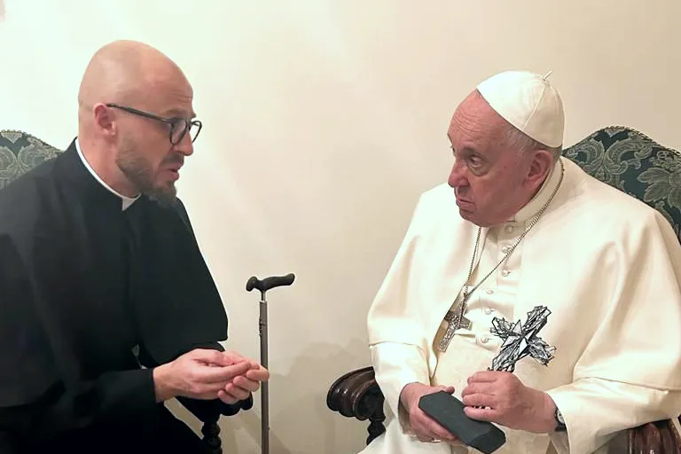 Father Vyacheslav Grynevych gave Pope Francis with a cross made out of broken glass and rubble from destroyed buildings in Kyiv on Feb. 21, 2023.?w=200&h=150