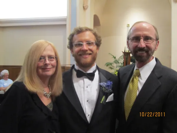 Peter and Kathy Adamski with their son, John. Credit: Photo courtesy of Father Peter Adamski