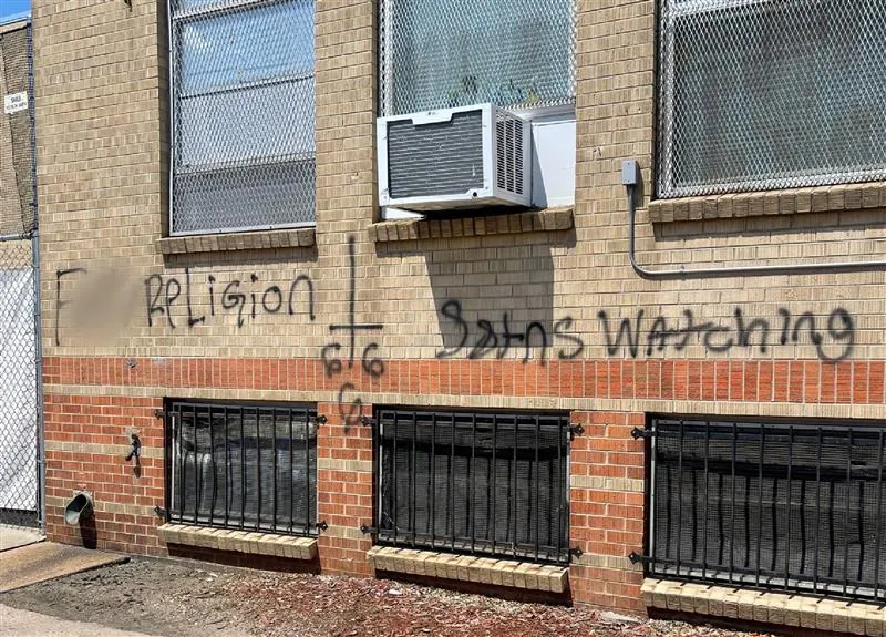 F*** religion,' 'Satans watching,' '666,' and an upside down cross were drawn on the side of Annunciation Catholic School in Denver in June.?w=200&h=150