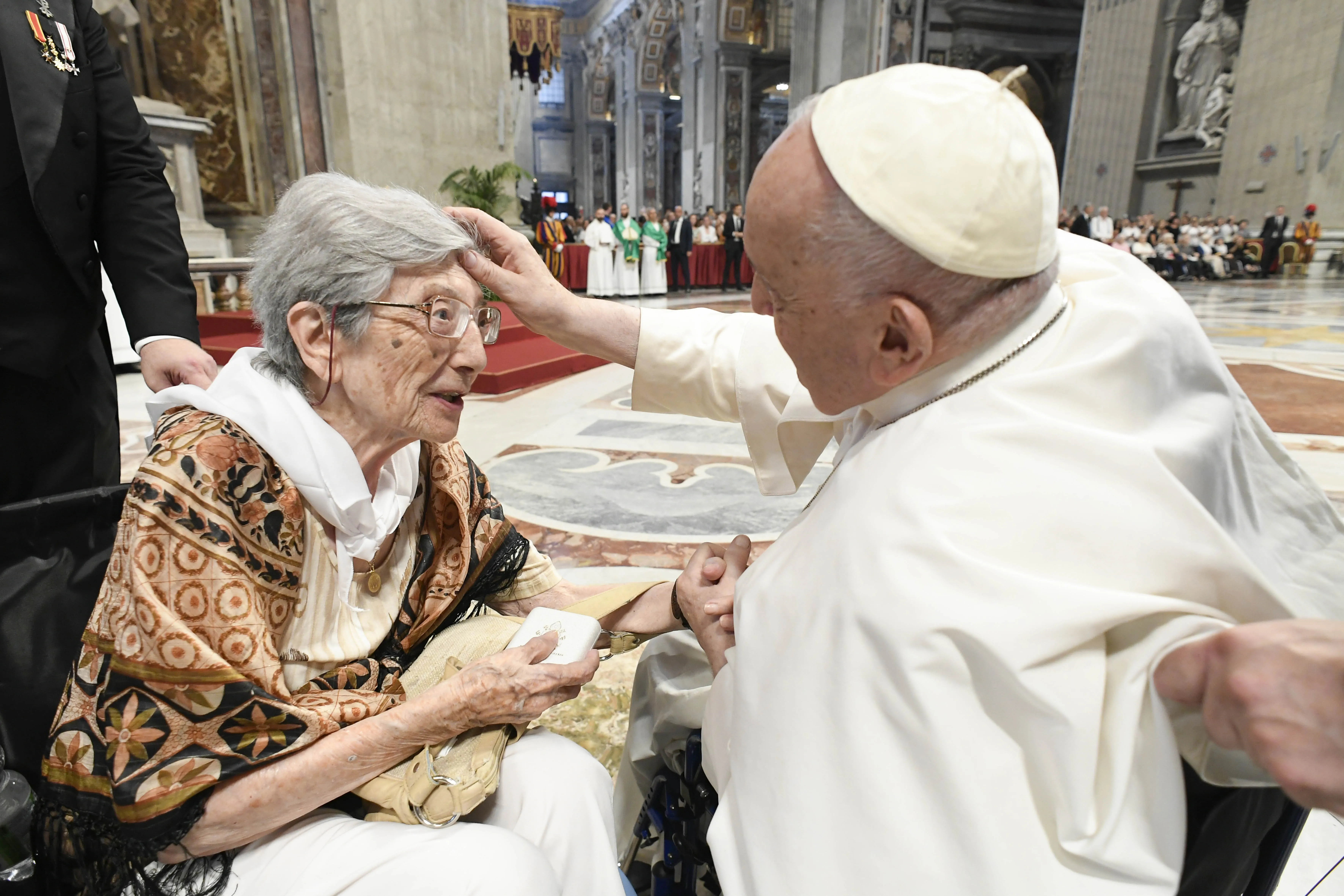 Pope Francis blesses a woman in St. Peter's Basilica, where he presided over a special papal Mass on July 23, 2023, marking the third annual World Day for Grandparents and the Elderly.?w=200&h=150