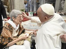 Pope Francis blesses a woman in St. Peter's Basilica, where he presided over a special papal Mass on July 23, 2023, marking the third annual World Day for Grandparents and the Elderly.