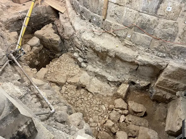 A Roman street found during archeological investigations in the North-East deambulatory of the Basilica of the Holy Sepulcher. Sections of a street were found under the walls of the Christian basilica. It is a grated street with sidewalks that was destroyed for the construction of the Constantinian church. Credit: La Sapienza - University of Rome
