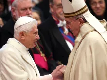 Pope Emeritus Benedict XVI is greeted by Pope Francis during the Ordinary Public Consistory at St. Peter’s Basilica on Feb. 14, 2015.