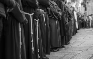 Franciscan friars line the Via Dolorosa in the Old City of Jerusalem. Shutterstock