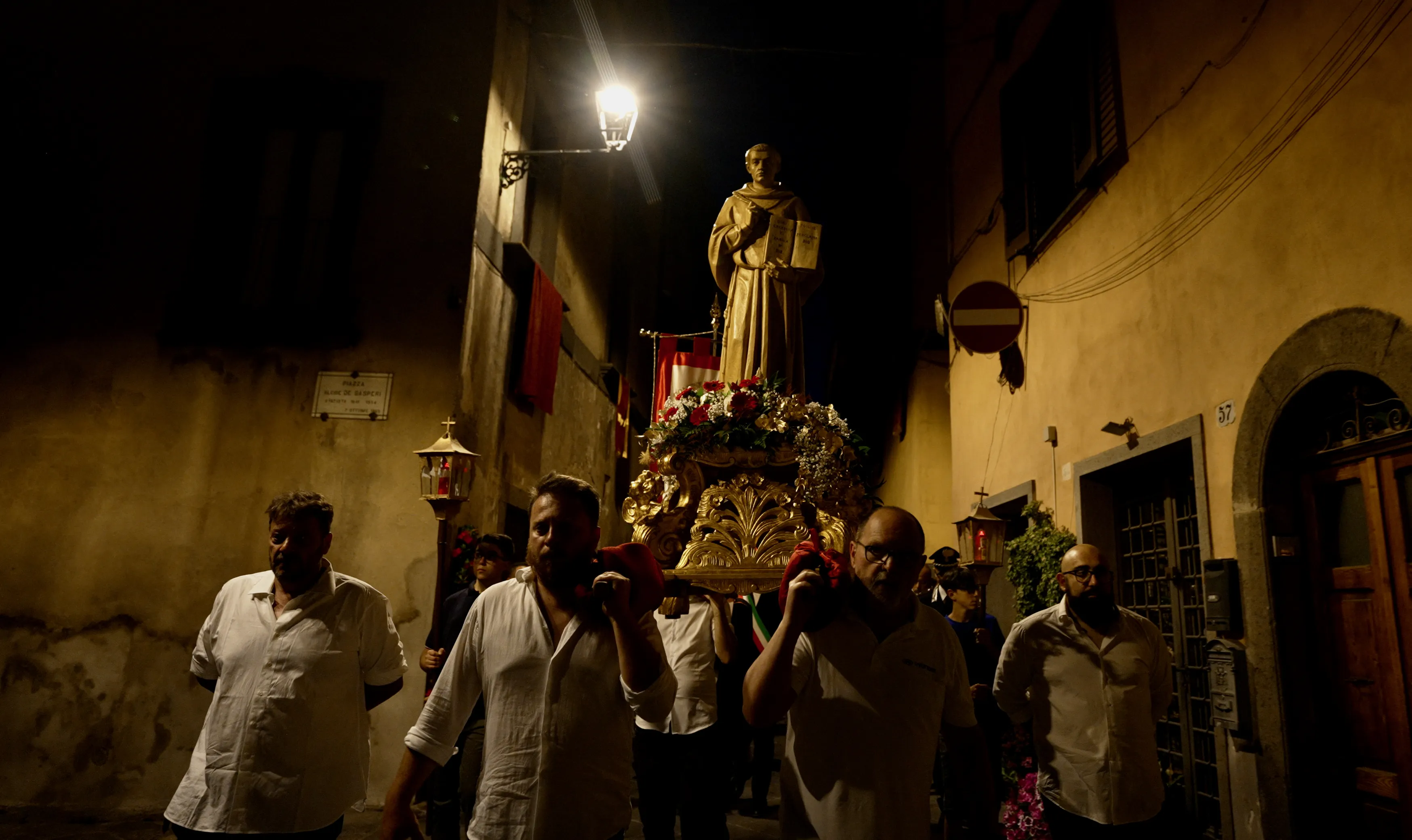 Four men carry a statue of St. Bonaventure during a candlelight procession on July 14, 2023, in Bagnoregio, Italy, his birthplace, on the vigil of the saint's feast day.?w=200&h=150
