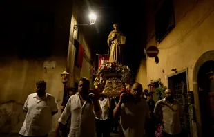 Four men carry a statue of St. Bonaventure during a candlelight procession on July 14, 2023, in Bagnoregio, Italy, his birthplace, on the vigil of the saint's feast day. Patrick Leonard/CNA