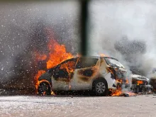 Cars are seen on fire following a rocket attack from the Gaza Strip in Ashkelon, southern Israel, on Oct. 7, 2023.