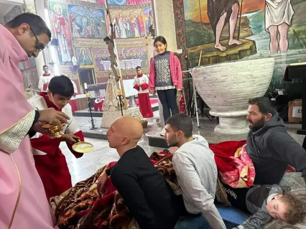 Injured parishioners receive Communion on the third Sunday of Advent, Dec. 17, 2023, at Holy Family Parish in Gaza. Credit: Father Gabriel Romanelli/Facebook
