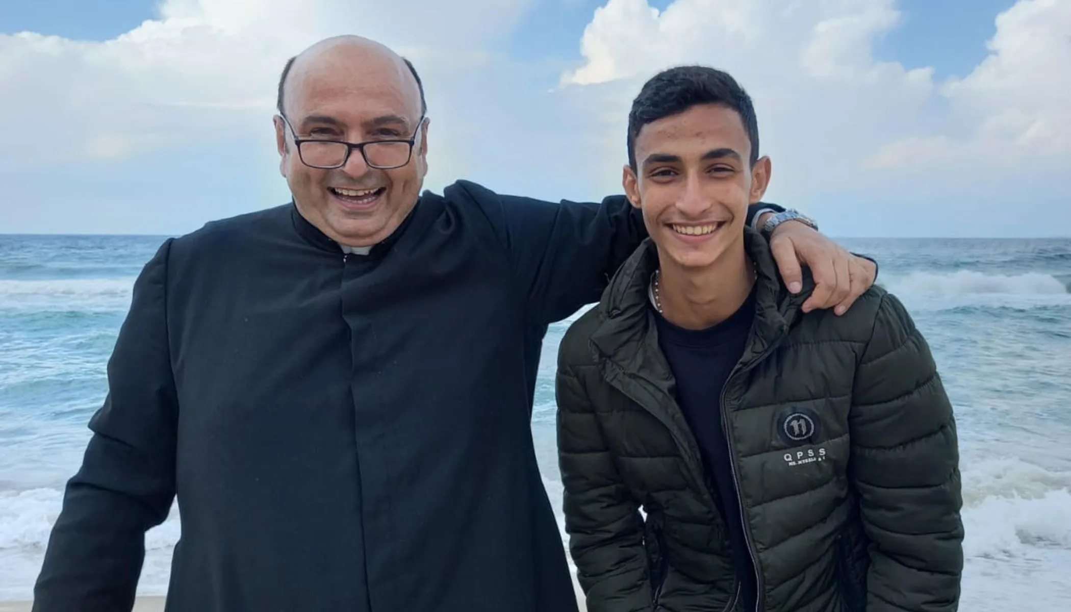 Suhail Shadi Abu Dawod with Father Gabriel Romanelli, the parish priest of Gaza, on the seashore in Gaza last summer 2023. Romanelli, belongs to the Institute of the Incarnate Word (IVE), a Catholic clerical religious institute founded in Argentina on March 25, 1984, which Abu Dawod has petitioned to join.?w=200&h=150