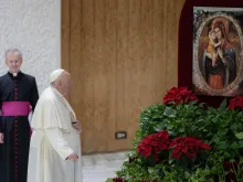 Pope Francis stops to pray before an image of Our Lady and the Child Jesus during his weekly general audience on Jan. 11, 2023.