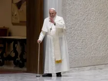 Pope Francis walked with a cane into Paul VI Hall for his Wednesday audience on Aug. 3, 2022.