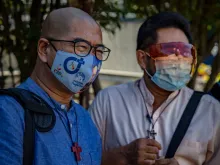 Fathers Flaviano “Flavie” Villanueva (left) and Albert Alejo speak to the media before appearing for court on Feb. 11, 2021, in Quezon City, Metro Manila, Philippines.
