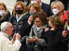 Pope Francis meets a group of women at the end of his weekly general audience at the Paul VI hall in the Vatican on March 2, 2022.