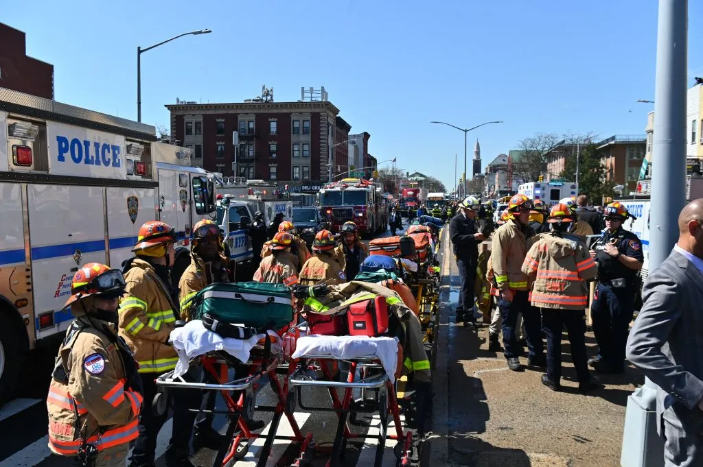 Emergency personnel crowd the streets near a subway station in New York City on April 12, 2022, after at least 16 people were injured during a rush-hour shooting in the Brooklyn borough of New York.?w=200&h=150