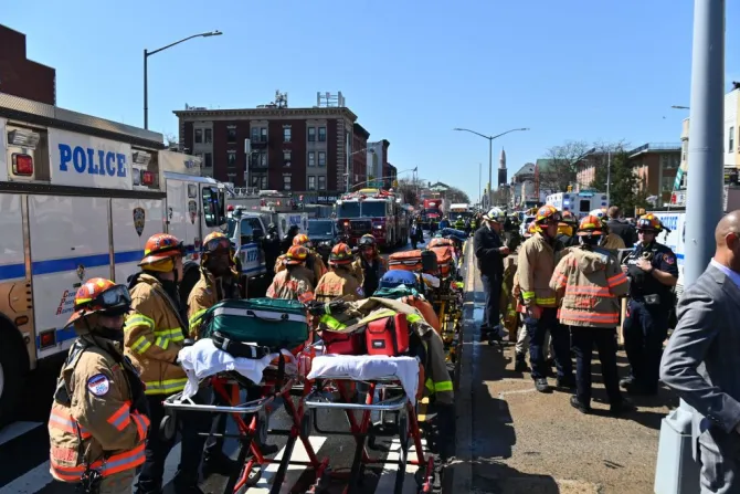 Emergency personnel crowd the streets near a subway station in New York City on April 12, 2022, after at least 16 people were injured during a rush-hour shooting in the Brooklyn borough of New York.