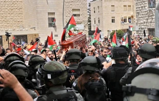 Violence erupts between Israeli security forces and Palestinian mourners carrying the coffin of slain Al-Jazeera journalist Shireen Abu Akleh out of a hospital, before being transported to a church and then her resting place, in Jerusalem, on May 13, 2022. Ahmad Gharabli/AFP via Getty Images