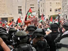 Violence erupts between Israeli security forces and Palestinian mourners carrying the coffin of slain Al-Jazeera journalist Shireen Abu Akleh out of a hospital, before being transported to a church and then her resting place, in Jerusalem, on May 13, 2022.