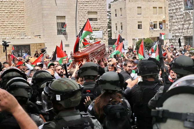 Violence erupts between Israeli security forces and Palestinian mourners carrying the coffin of slain Al-Jazeera journalist Shireen Abu Akleh out of a hospital in Jerusalem, on May 13, 2022.