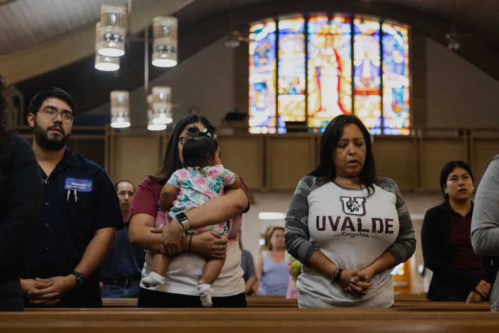 Parishioners mourn at Sacred Heart Catholic Church on May 25, 2022 in Uvalde, Texas. On May 24, 21 people were killed, including 19 children, during a mass shooting at Robb Elementary School. The shooter, identified as 18-year-old Salvador Ramos, was reportedly killed by law enforcement.?w=200&h=150