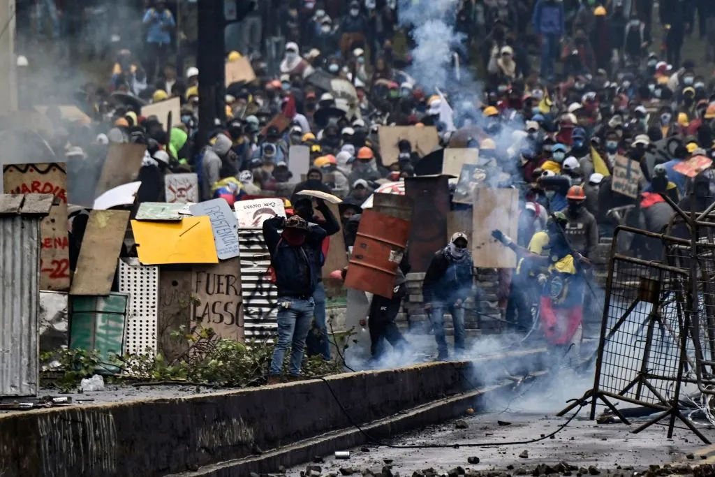 Demonstrators clash with riot police, nearby El Ejido park, in Quito, on June 24, 2022, in the framework of indigenous-led protests against the government. - Ecuador's government and Indigenous protesters accused each other of intransigence as thousands gathered for a 12th day of a fuel price revolt that has claimed six lives and injured dozens. After the most violent day of the campaign so far -- with police firing tear gas to disperse thousands storming Congress -- the government accused protesters of shunning a peaceful outcome.?w=200&h=150