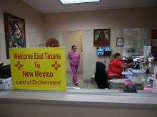 A sign welcoming patients from East Texas is displayed in the waiting area of the Women's Reproductive Clinic, which provides legal medication abortion services, in Santa Teresa, New Mexico, on June 15, 2022.