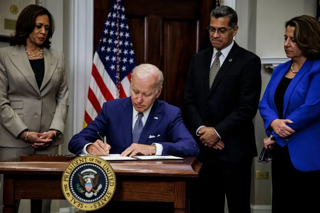 US President Joe Biden, with (L-R) Vice President Kamala Harris, Health and Human Services Secretary Xavier Becerra and Deputy Attorney General Lisa Monaco, signs an executive order protecting access to reproductive health care services, in the White House in Washington, DC, July 8, 2022.?w=200&h=150