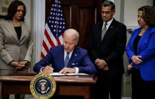 US President Joe Biden, with (L-R) Vice President Kamala Harris, Health and Human Services Secretary Xavier Becerra and Deputy Attorney General Lisa Monaco, signs an executive order protecting access to reproductive health care services, in the White House in Washington, DC, July 8, 2022. Samuel Corum/AFP via Getty Images