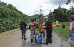 A stranded family is rescued from the flood waters of the north fork of the Kentucky River in Jackson, Ky., on July 28, 2022. Catholic Charities of Lexington is collaborating with other Christian churches as well as Catholic Charities USA to provide aid to those affected. Photo by LEANDRO LOZADA/AFP via Getty Images