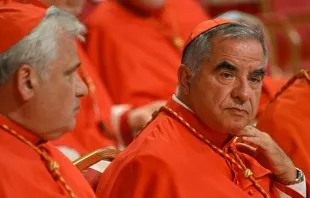 Italian Cardinal Giovanni Angelo Becciu (right) waits prior to the start of a consistory during which 20 new cardinals are to be created by the pope, on Aug. 27, 2022, at St. Peter's Basilica in the Vatican. Credit: ALBERTO PIZZOLI/AFP via Getty Images