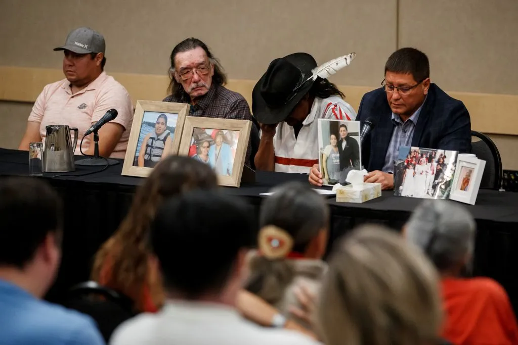 Mark Arcand (R), brother of James Smith Cree Nation stabbing victim Bonnie Burns, and Brian (2nd R), husband of Bonnie, pause behind pictures of Bonnie during a news conference in Saskatoon, Saskatchewan, Canada, Sept. 7, 2022. - One of two brothers who were the target of a massive manhunt in Canada after allegedly carrying out a stabbing spree that left 10 dead and 18 wounded has been found dead, police said on September 5. The killings in the remote James Smith Cree Nation Indigenous community and the town of Weldon in Saskatchewan province in western Canada are among the deadliest incidents of mass violence ever to hit the nation.?w=200&h=150