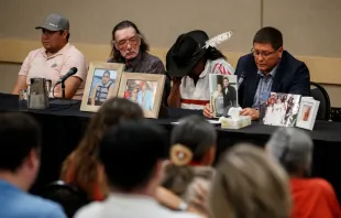 Mark Arcand (R), brother of James Smith Cree Nation stabbing victim Bonnie Burns, and Brian (2nd R), husband of Bonnie, pause behind pictures of Bonnie during a news conference in Saskatoon, Saskatchewan, Canada, Sept. 7, 2022. - One of two brothers who were the target of a massive manhunt in Canada after allegedly carrying out a stabbing spree that left 10 dead and 18 wounded has been found dead, police said on September 5. The killings in the remote James Smith Cree Nation Indigenous community and the town of Weldon in Saskatchewan province in western Canada are among the deadliest incidents of mass violence ever to hit the nation. Cole Burston/AFP via Getty Images