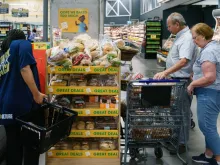 Shoppers are seen in a Kroger supermarket on Oct. 14, 2022, in Atlanta. Economic prospects are becoming "more pessimistic" in the United States on growing worries of weaker demand, the Federal Reserve said in a report Oct. 19, 2022, citing heightened inflation and rising interest rates.